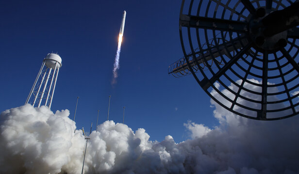 A rocket with Cygnus resupply spacecraft onboard, launches from launch pad in Virginia heading into space to the international space system. Digitally enhanced elements of this image furnished by NASA