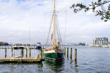 Fototapeta premium A Sailboat Docked Outside of a Waterfront Condo on the Elizabeth River in Norfolk Virginia