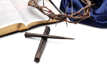 Ð¡rucifixion Spikes with nails in shape Of Cross On the Bible