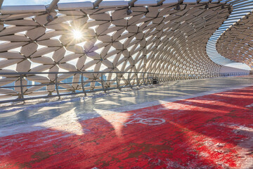 Modern architectural urbanistic Atyrau fish bridge across Ishim river. Pedestrian bridge with...