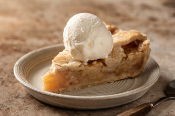 Piece of traditional apple pie with ice cream on brown textured background, menu