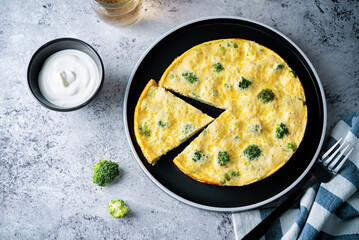 Broccoli Frittata in a plate with sauce