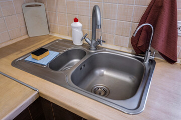 metal sink faucet in a modern kitchen