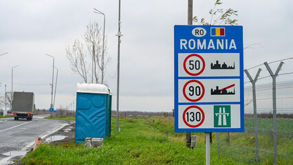 Sign at the entrance to Romania. The border between the Romania and Serbia. Highway. Inscription:...