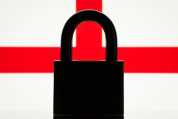 Silhouette of closed lock with flag of England on the background. Concept of closed England, restrictions, sanctions, ban