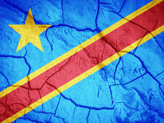Flag of Democratic Republic of the Congo. Congo symbol. Flag on the background of dry cracked earth. Congo flag with drought concept