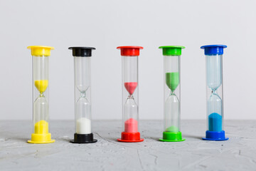 hourglass on the table, sand clock as time passing concept for business deadline, copy space