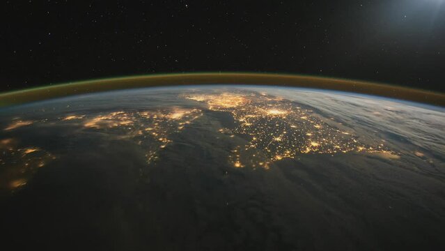 Nocturnal flight over Great Britain and northern Europe.As seen from the International Space Station. Elements of this clip furnished by NASA.