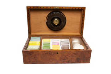 wooden box with humidor filled with tea of different flavors and colors oak root wood cigar box with transparent background png with space for text