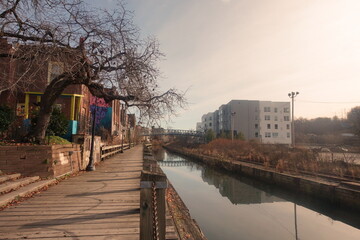 Obraz premium Boardwalk By City Canal on Winter Day