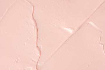 Pink cosmetic clay smudge background. Pink creamy cosmetic texture. Pink clay mask textured smears...