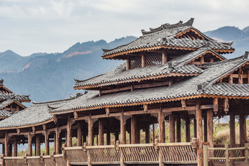 Wooden pavilion on the mountains background.