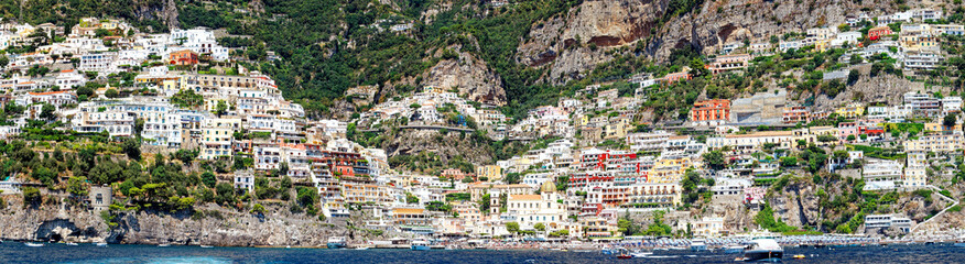 Fototapeta na wymiar Summer panorama of Positano along the Amalfi coast, seen from the sea in front of the town