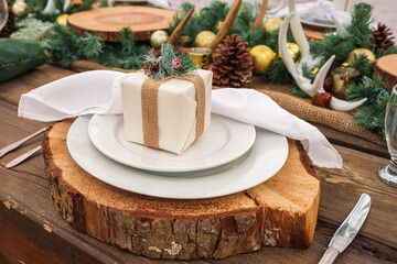 Rustic christmas served table. Beautiful table setting with Christmas decorations in living room