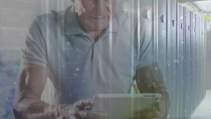 Animation of white particles over caucasian senior man using digital tablet against server room - Powered by Adobe