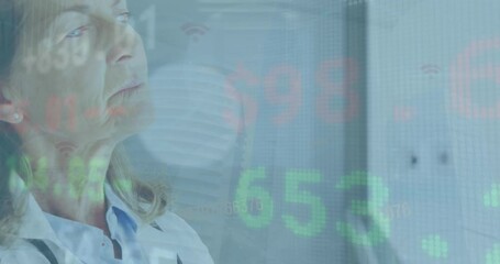 Animation of stock market data processing over thoughtful caucasian senior female doctor - Powered by Adobe