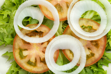 Fresh salad with lettuce, tomato and onion. Typical Brazilian food. Selective focus