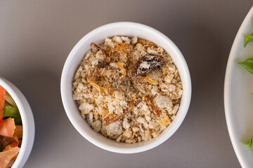 Delicious cassava farofa. Top view. Typical Brazilian food. Selective focus