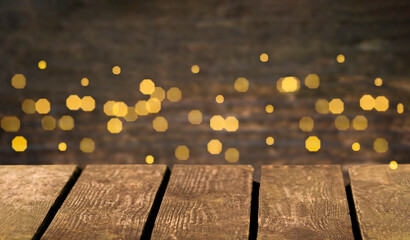 defocused lights bokeh and wooden surface background with copy space