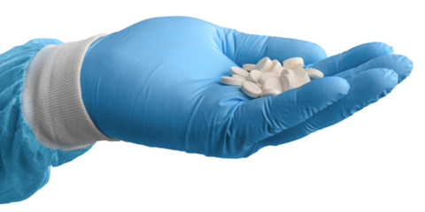 Scientist hands holding Omega 3 capsule in labcoat, doing experiments in lab