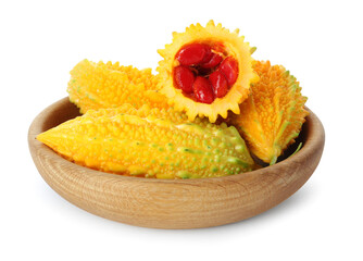 Wooden bowl with fresh ripe bitter melons on white background