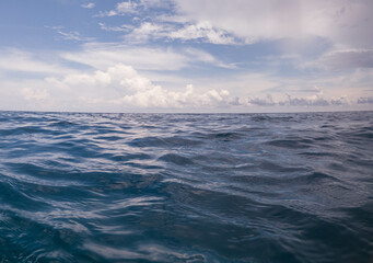 calm ocean surface and cloudy sky indonesia