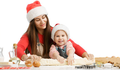 Friendly young mother with little daughter cook at modern kitchen