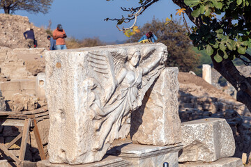 Carved in stone relief of the goddess of victory Nike in Domitianus Square at the ruins of the...