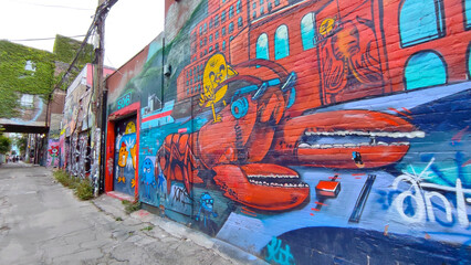 Colourful graffiti paintings on graffiti alley in Toronto, Canada.  Street art, background, texture.
