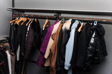 Wardrobes of a restaurant with clothes