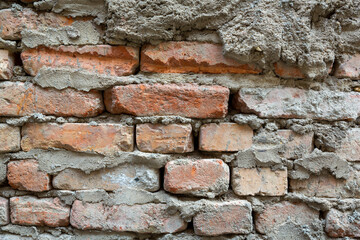 Red background of old vintage brick wall texture. Close-up view of an old stone 