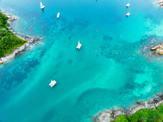 Fototapeta na wymiar Aerial view Amazing open sea,Beautiful ocean in the morning summer season,Image by Aerial view drone shot,high angle view boats Top down seashore background