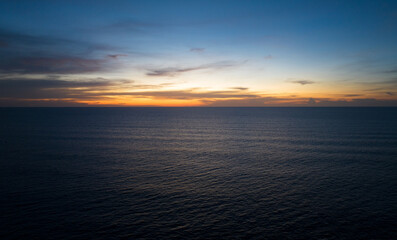Aerial view Nature beautiful Light Sunset or sunrise over sea surface, Colorful Dramatic majestic scenery Sky with Amazing clouds in sunset sky cloud background,High angle view