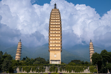 A low angle shot of The Three Pagodas of the Chongsheng Temple, Dali, China, dramatic cloudy sky with copy space for text