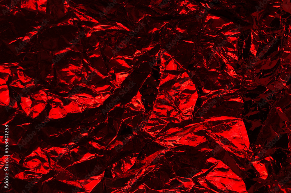 Aufkleber crumpled plastic wrap texture in red color gradient for background and photo overlay effect