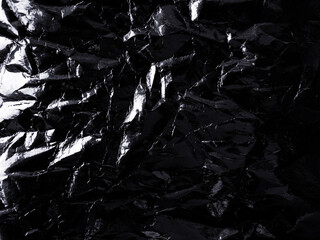 Wrinkled black plastic wrap texture for background and photo overlay effect