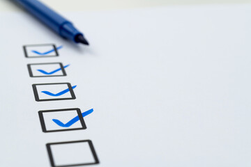 Blue pen marking on checklist sheet