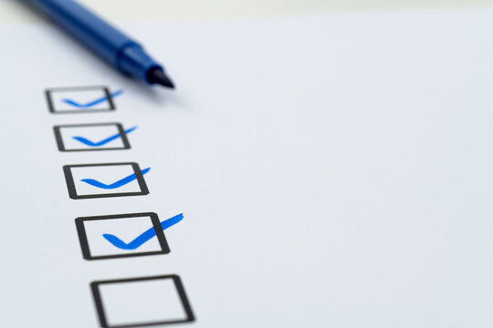 Blue pen marking on checklist sheet