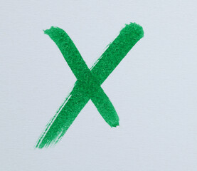 A green cross on the paper
