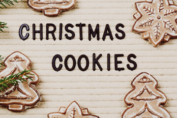 Christmas cookies. Letter board with words and branches of spruce. Winter concept.