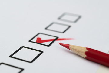 Red pen marking on checklist sheet