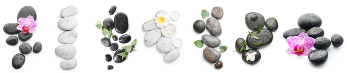 Set of spa stones and beautiful flowers on white background, top view