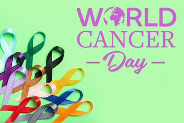 Many colorful ribbons and text WORLD CANCER DAY on green background