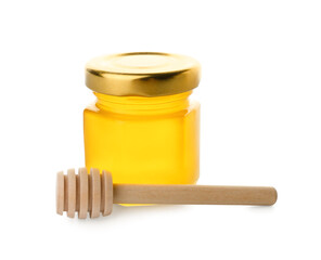 Jar with delicious honey and dipper on white background