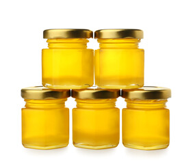 Jars with honey on white background