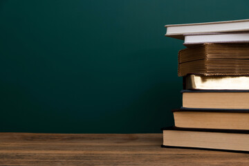 Stack books in front of the blackboard