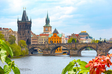 Prague spring cityscape with Charles Bridge, Vltava river, tower and medieval architecture