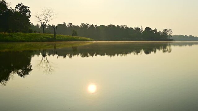 Huay Tueng Thao Lake in the early morning, The lake offers beautiful scenery, fresh air and steam rising from the surface, Chiang Mai Province.