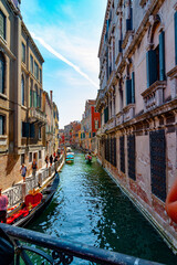 Obraz na płótnie Canvas A canal view from a bridge in Venice, Italy