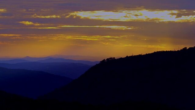relaxing unique sunset countryside rural spanish andalucia sierra jamones old white villages of the Sierra de Aracena, Huelva Jabugo purple and orange colors of the sunset